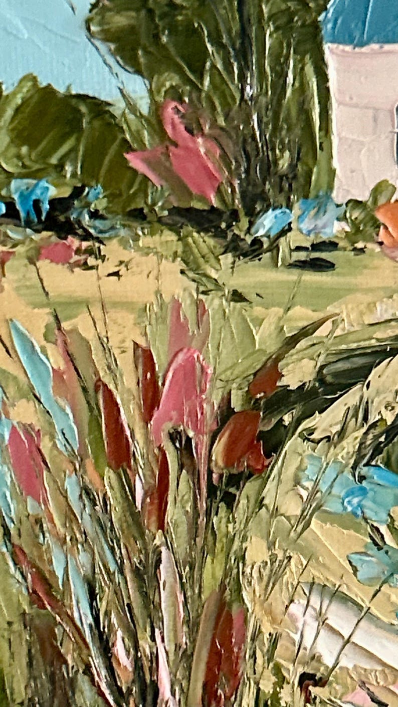 May include: An oil painting on canvas featuring a textured landscape with thick impasto brushstrokes. The scene displays a field of tall grasses in shades of sage green, tan, and pink, accented by bright blue flowers and a white structure in the distance.