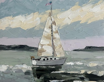 May include: An oil painting on canvas featuring a sailboat with white sails and a small American flag at the masthead. The vessel floats on choppy, dark gray water with visible brushstrokes, set against a pale, muted sky and distant land.