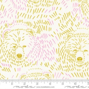 May include: White fabric with a repeating pattern of bear faces and pink and gold linear accents. The bears are outlined in gold, with pink lines filling in some areas. The fabric has a ruler along the bottom edge.