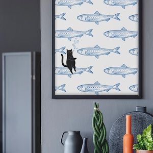Featuring a retro-inspired blue sardine pattern on a crisp white background, this design stands out with a playful black cat floating among the fish, blowing bubbles. A perfect mix of vintage charm and quirky humor.