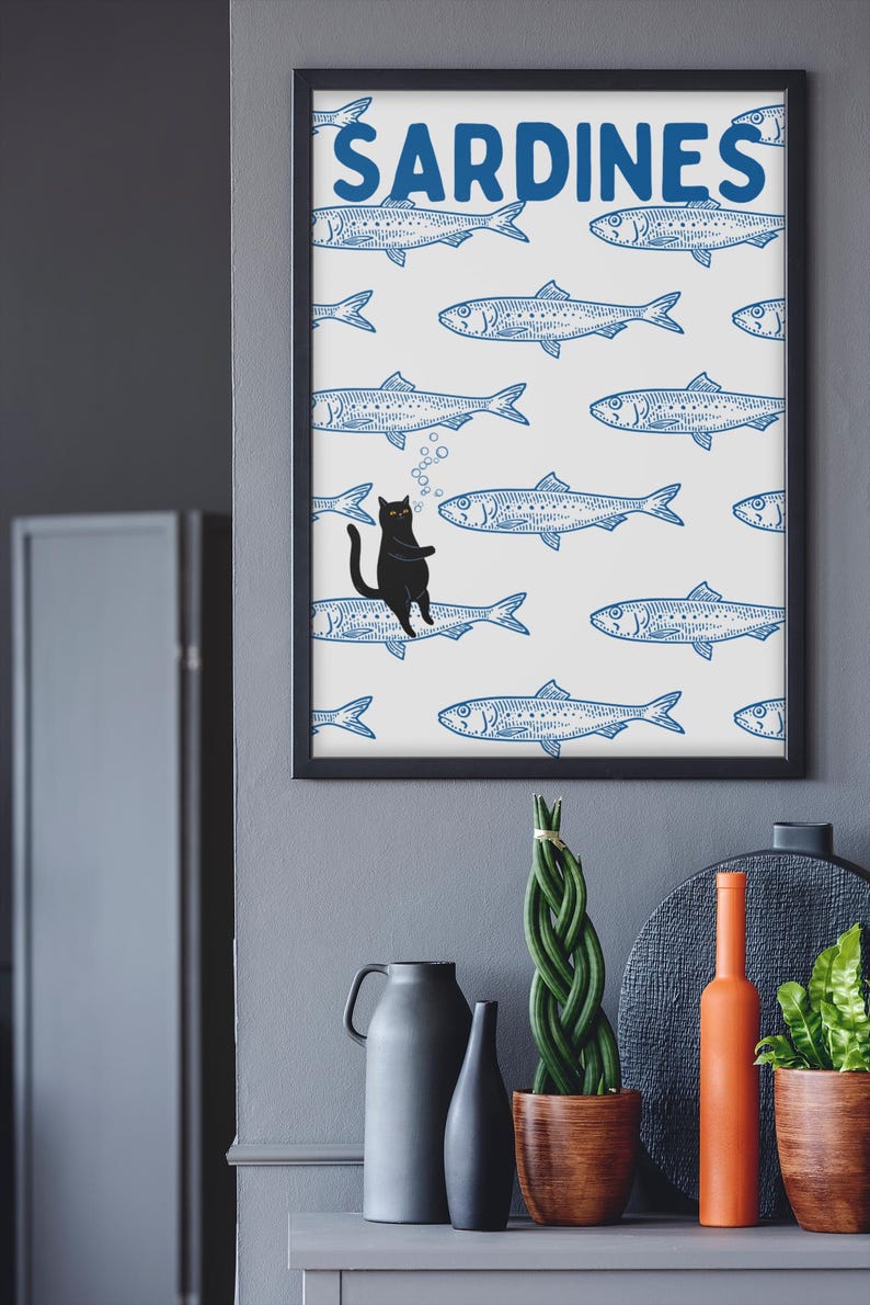 Featuring a retro-inspired blue sardine pattern on a crisp white background, this design stands out with a playful black cat floating among the fish, blowing bubbles. A perfect mix of vintage charm and quirky humor.