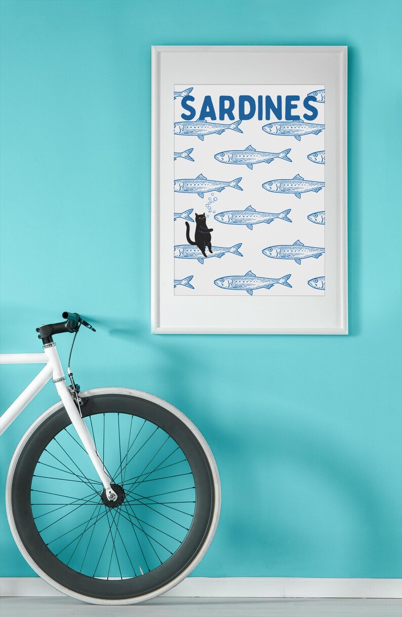 Featuring a retro-inspired blue sardine pattern on a crisp white background, this design stands out with a playful black cat floating among the fish, blowing bubbles. A perfect mix of vintage charm and quirky humor.