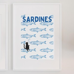 Featuring a retro-inspired blue sardine pattern on a crisp white background, this design stands out with a playful black cat floating among the fish, blowing bubbles. A perfect mix of vintage charm and quirky humor.