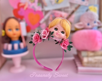 Diadema de flores con cabeza de muñeca vintage kitsch