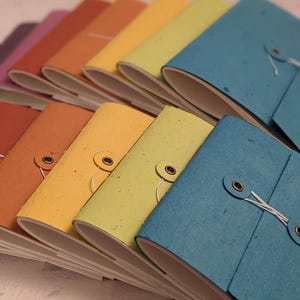 Cuaderno de bolsillo con botón y cordón de algodón plantable