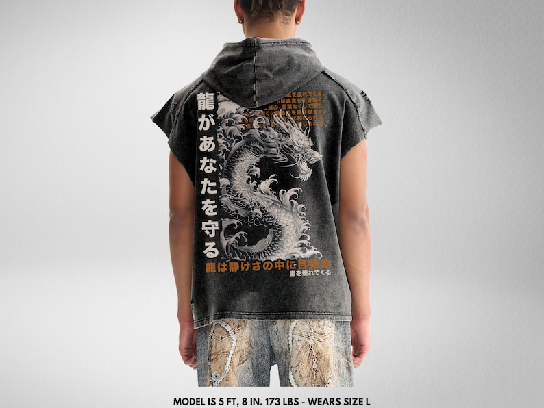 May include: A black distressed denim short-sleeved shirt with a graphic print of a dragon and Japanese text that reads "龍があなたを守る 龍は静けさの中に自を連れてくる".