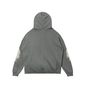 May include: A gray hoodie with a hood and long sleeves. The sleeves feature a white, feathery design. The hoodie is made of a soft material and has a relaxed fit. The back view of the hoodie is shown.