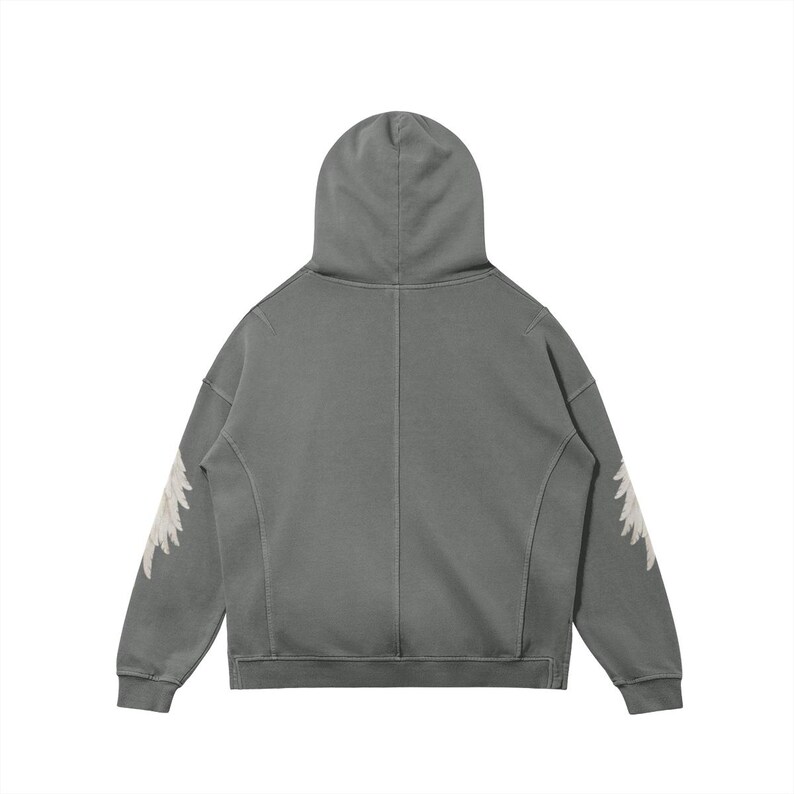 May include: A gray hoodie with a hood and long sleeves. The sleeves feature a white, feathery design. The hoodie is made of a soft material and has a relaxed fit. The back view of the hoodie is shown.