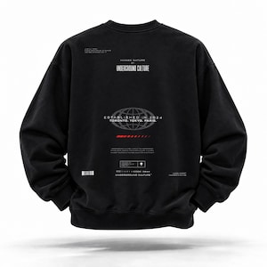 May include: A black long-sleeve sweatshirt featuring white graphic text and a globe icon on the back. The print includes the words HUMAN NATURE BY UNDERGROUND CULTURE, ESTABLISHED IN 2024, TORONTO, TOKYO, PARIS, and a small red horizontal bar graphic.