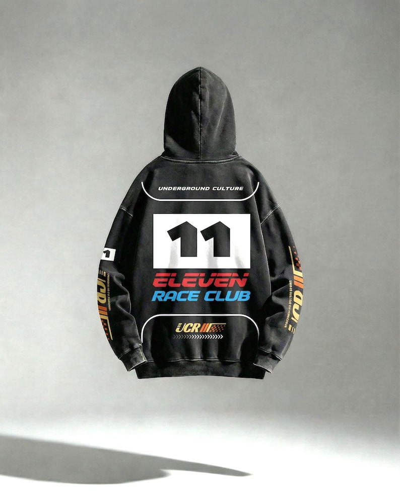 May include: Black hooded sweatshirt with the text "UNDERGROUND CULTURE" above a white rectangle with the number "11" in black. Below, the text "ELEVEN RACE CLUB" is in red and blue. The sleeves have colorful racing-themed graphics.