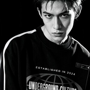May include: A black long-sleeve sweatshirt with white side stripes and a graphic print featuring the text ESTABLISHED IN 2024, UNDERGROUND CULTURE, TORONTO, TOKYO, PARIS, and the Japanese characters 時刻 centred within an oval globe design.