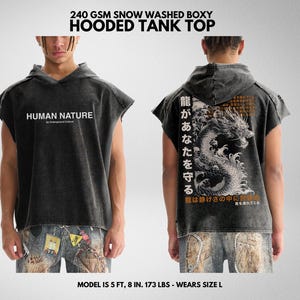 May include: A black hooded tank top with a distressed look. The front of the tank top has the text "HUMAN NATURE" printed on it. The back of the tank top has a graphic of a dragon with Japanese text. The model is 5 feet 8 inches tall and weighs 173 pounds. The model is wearing size L.
