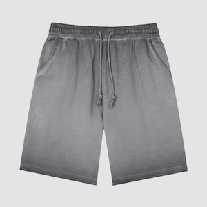 May include: Grey cotton shorts with a drawstring waist.