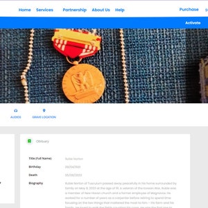 May include: A website homepage for a memorial service for Ruble Norton. The website features a photo of Ruble Norton, a blue and white color scheme, and a navigation bar with links to "About", "Photos", "Videos", "Audio", and "Grave Location".