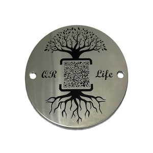 May include: A silver round metal tag with a black tree design, roots, and a QR code. The text "QR Life" is engraved on the tag.