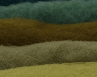 May include: A collection of soft, fibrous material arranged in five distinct horizontal layers. The colors transition from a deep dark teal at the top, followed by a muted sage green, a rich earthy brown, a light olive green, and a bright lime yellow.