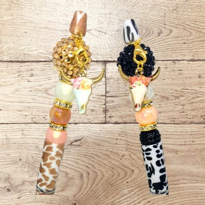 Cow beaded pens.