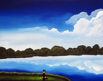 May include: A painting of a black dog sitting on a grassy hill overlooking a lake. The sky is blue with white clouds and the lake reflects the sky and clouds.