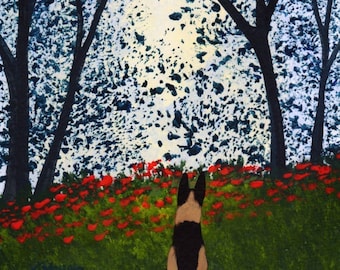 May include: A black and tan German Shepherd dog sits in a field of red poppies, looking towards a blue and white sky with trees in the background.