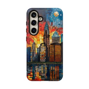 May include: A phone case with a mosaic design of a cityscape at sunset. The case features a colorful mosaic pattern with a cityscape silhouette, including skyscrapers and a reflection in the water. The case has a cutout for the phone's camera.