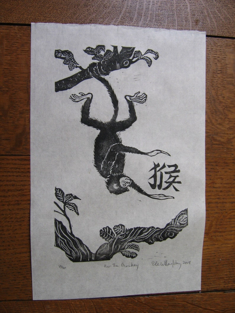 May include: Black and white woodblock print of a monkey hanging upside down from a tree branch. The monkey is labeled "猴" in Chinese characters. The print is titled "Howl the Monkey" and signed "Elle Willoughby, 2007".