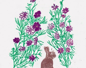 Cottontail rabbit amongst garden cosmos lino block print
