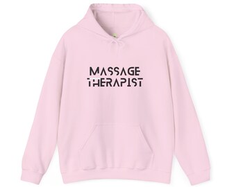 May include: A pink hoodie with a black graphic that says "MASSAGE THERAPIST" in a geometric font.
