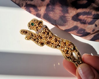 Leopard brooch hand embroidered with beads.