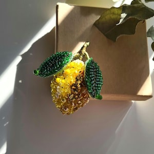 Lemon brooch made of beads and crystals. Handmade. Lemon brooch as a gift to loved ones.