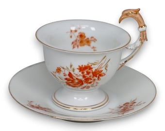 Xícara de chá com pires e alça de pássaro em porcelana floral Rosenthal RC Germany, antiga, c. 1900.