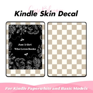 May include: Kindle skin decal featuring a black background with white floral and bee illustrations and the text "Just A Girl Who Loves Books." The other side has a tan and white checkered pattern. The text "Kindle Skin Decal" is at the top.