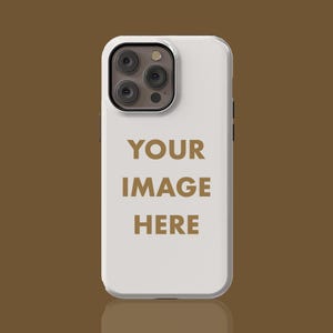 May include: White phone case with a camera lens cutout and the text "YOUR IMAGE HERE" printed in gold.