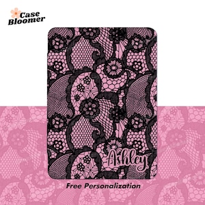 May include: A pink and black patterned phone case with a lace design. The name "Ashley" is written in a cursive font. The words "Free Personalization" are at the bottom.