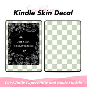 May include: Kindle skin decal featuring a black background with white floral illustrations and the text "Just A Girl Who Loves Books." The other side has a green and white checkered pattern. The decal is designed for Kindle Paperwhite and Basic models.