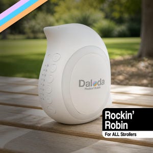 May include: A white, bird-shaped sound machine with a smooth, rounded body. The side features a vertical row of circular control buttons and the text Daloda Rockin' Robin. A black rectangular graphic in the corner displays the text Rockin' Robin For ALL Strollers.