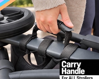 May include: A black stroller carry handle featuring a textured grip and adjustable fabric straps that wrap around the frame. The handle is labeled with the text Carry Handle For ALL Strollers in white font against a black rectangular background.