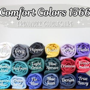 K&ouml;nnte beinhalten: Comfort Colors 1566 Crewneck Sweatshirt in verschiedenen Farben, darunter Wei&szlig;, Grau, Pfeffer, Butter, Orchidee, Violett, Kreide-Minze, Schaum, Hellgr&uuml;n, Blauer Fichte, Scharlachrot, Wassermelone, Lagunenblau, Champagner, Floblau, Jeansblau, Denim und Dunkelblau.