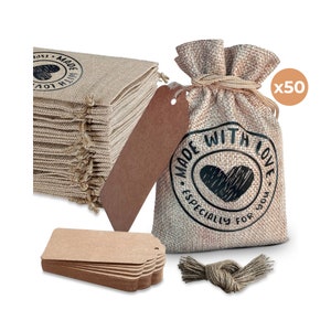 May include: A set of 50 small burlap bags with brown paper tags and twine. The bags are printed with the text "Made with Love. Especially for you." and a heart design.