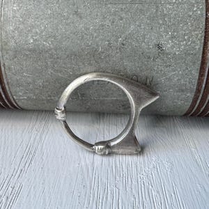 Mended cat ring handcast in sand from carved wax size 7.5 sterling silver