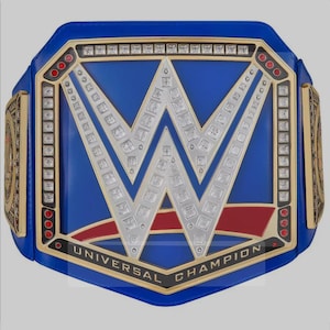 May include: A blue and gold wrestling championship belt with a large silver "W" in the center. The belt has red accents and the words "Universal Champion" on the bottom.