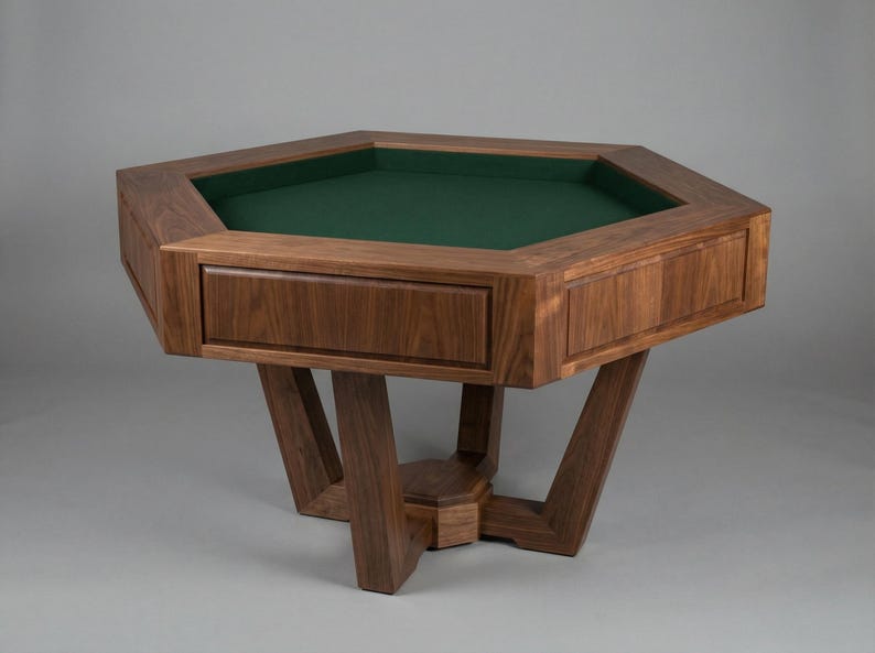 May include: A solid wood, octagonal game table with a green felt playing surface. The table has a drawer and is supported by a unique, angled leg design. The wood has a rich, dark brown finish.