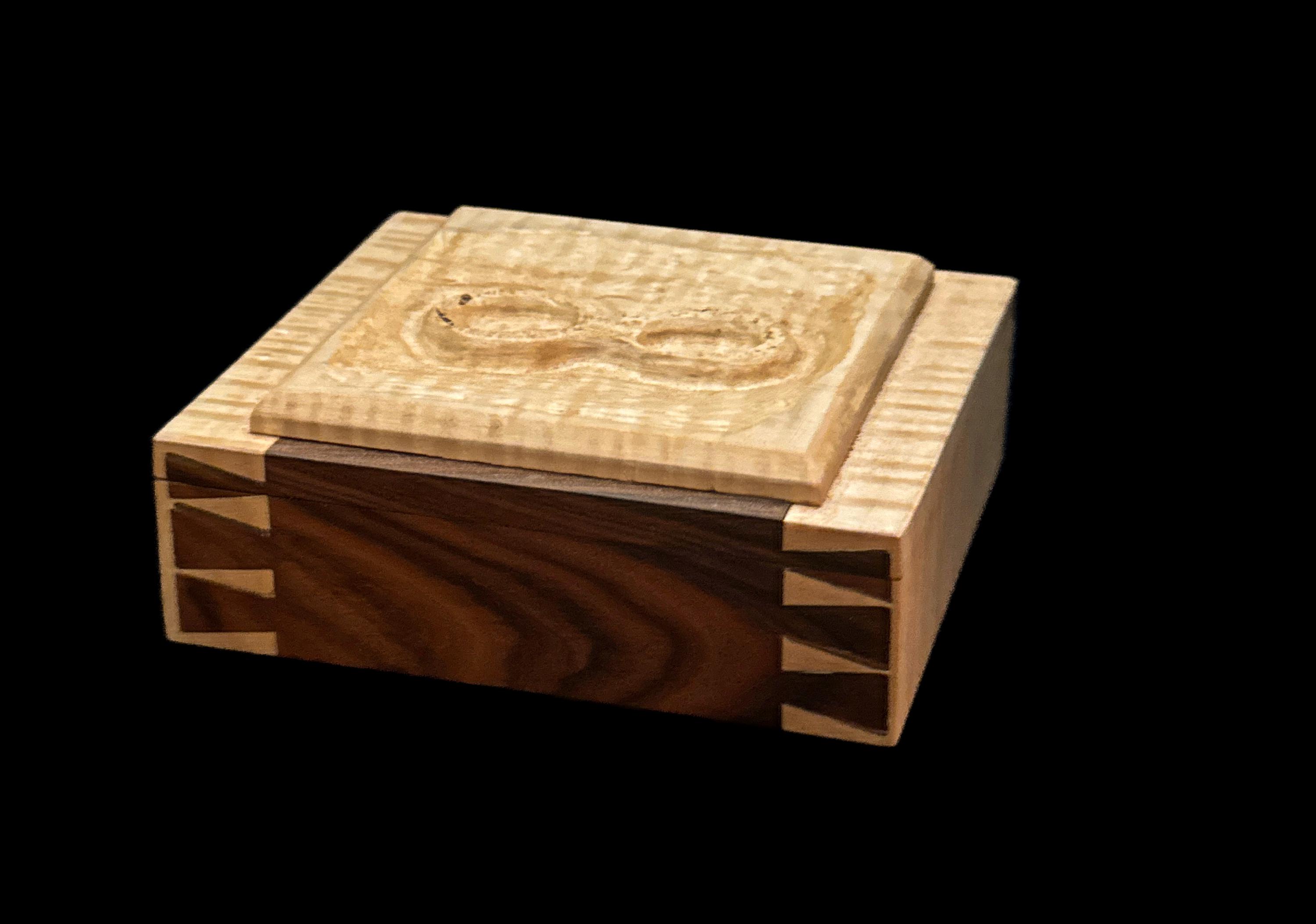 Custom handmade solid wood keepsake heirloom box with carved infinity lid and Spanish cedar liner. handcut dovetails from Bolivian rosewood