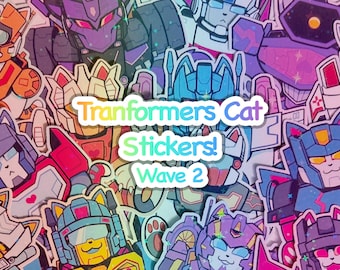 May include: A collection of colorful stickers featuring cartoon robots with cat faces. The stickers are in various colors, including orange, purple, blue, and yellow. Text on the stickers reads "Tranformers Cat Stickers! Wave 2."