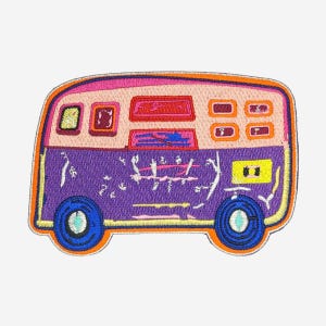 May include: An embroidered patch shaped like a van with a purple lower body and a light pink upper section. The design features blue wheels, orange trim, and various rectangular windows in red, yellow, and orange, with white abstract line details.