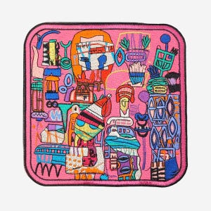 May include: A square embroidered patch with rounded corners featuring a vibrant pink background filled with a dense, multi-colored abstract pattern of geometric shapes, lines, and stylized figures in shades of blue, orange, yellow, and white.