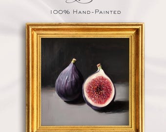 May include: A framed oil painting featuring two figs, one whole and one halved, showcasing a deep purple exterior and a vibrant red interior. The artwork is set against a dark background and framed in a gold ornate frame. The text "Lynn" and "100% Hand-Painted" are visible.