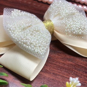 Elegant and exclusive pearl bow for the hair of girls and young people