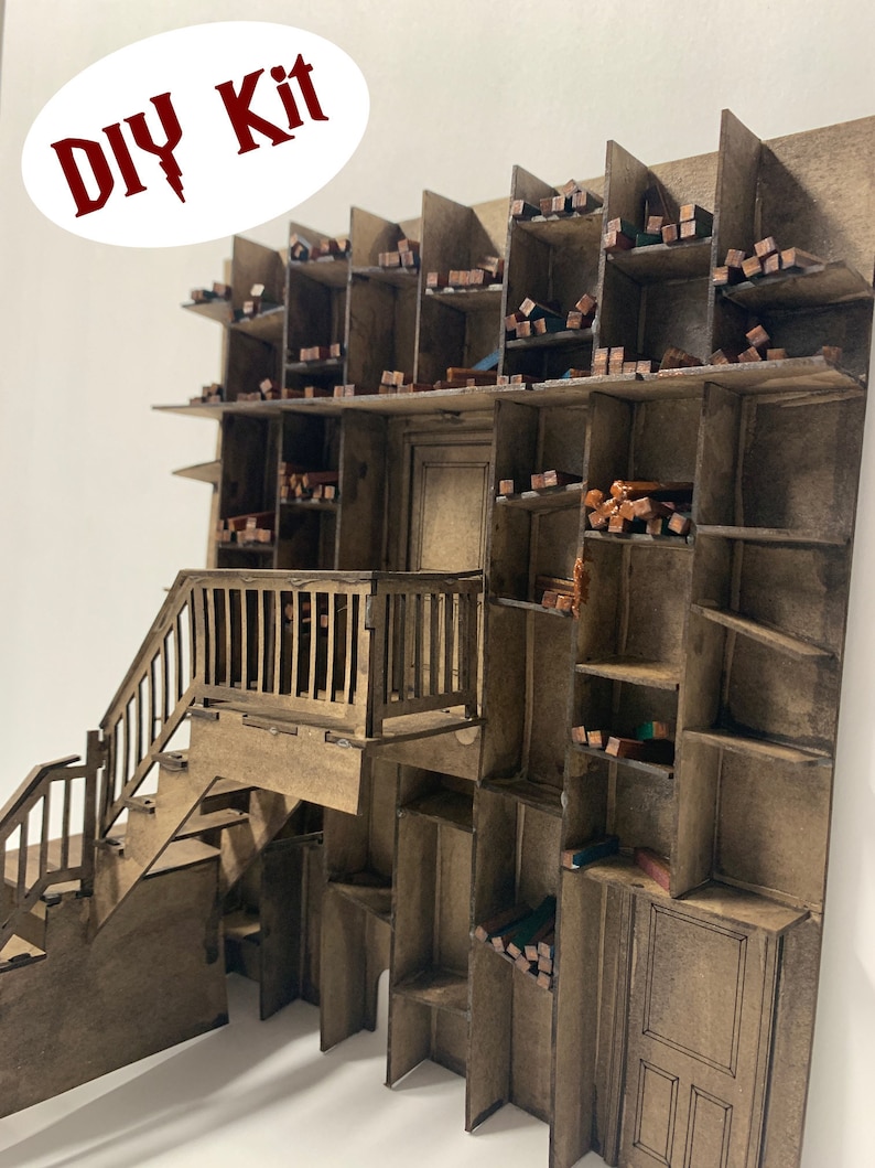 May include: DIY kit for a wooden model of a multi-level building with a staircase and shelves. The model is made of brown wood and has a rustic look.