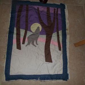 quilted wall hanging (needs binding) wolf howling at moon