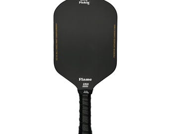 May include: Black pickleball paddle with a black handle and gold lettering that says "Love Pickle" and "Flame USA".